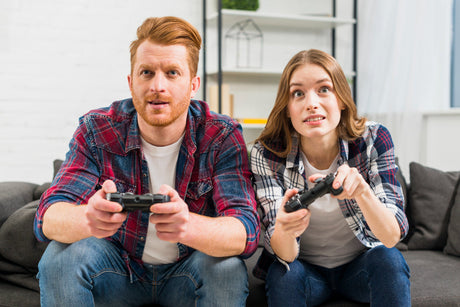 “Ergonomic gaming chair with high backrest, lumbar support, and adjustable armrests set up in a gaming station.”