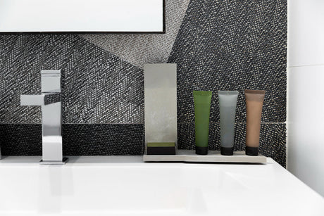 “Bathroom cabinets refreshed with new hardware, a fresh coat of paint, and decorative accents for a modernized look without full replacement.”