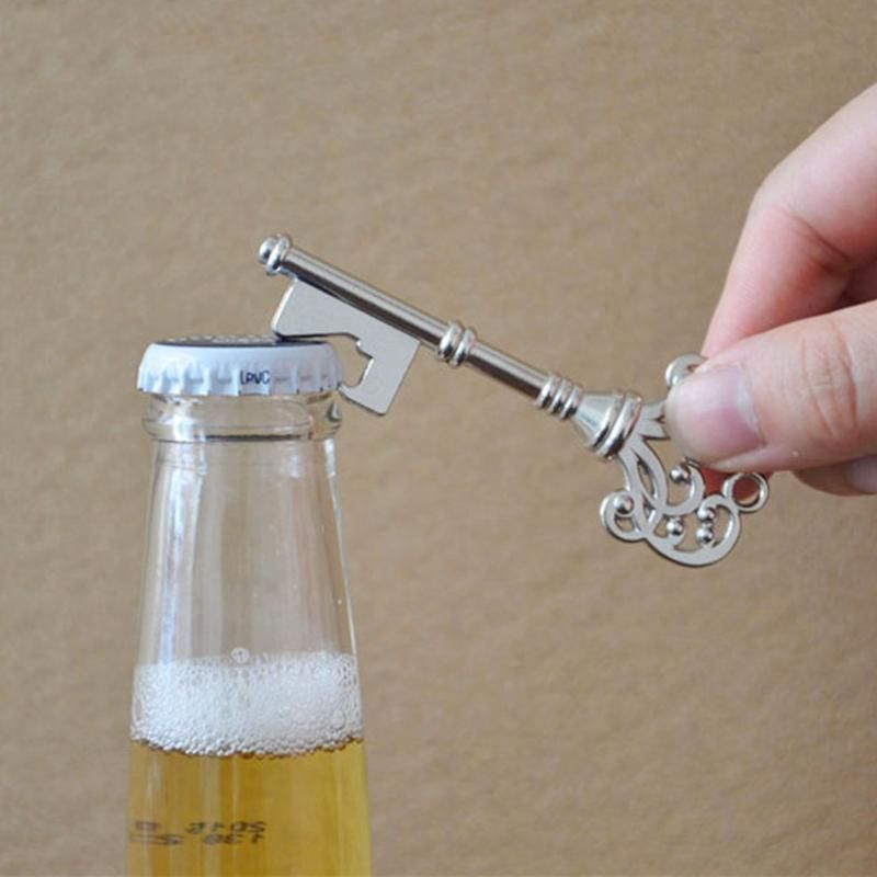 Vintage silver key bottle opener and cap opener