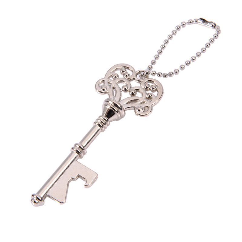 Vintage silver key bottle opener and cap opener