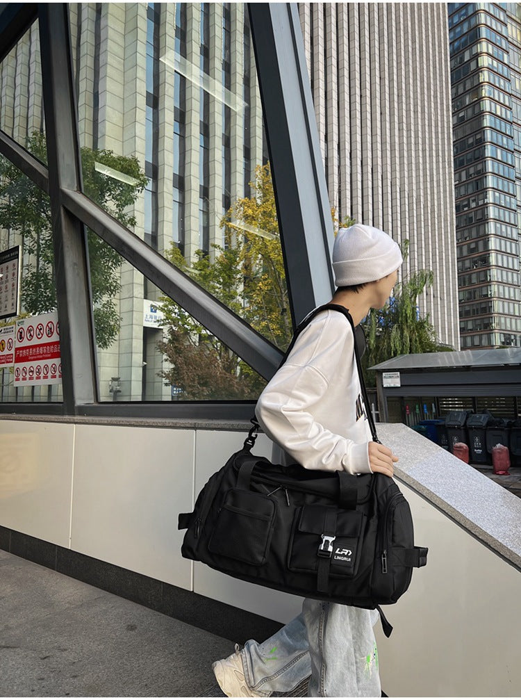 Black Unisex Travel Bag with Utility Buckles and Wet/Dry Compartments