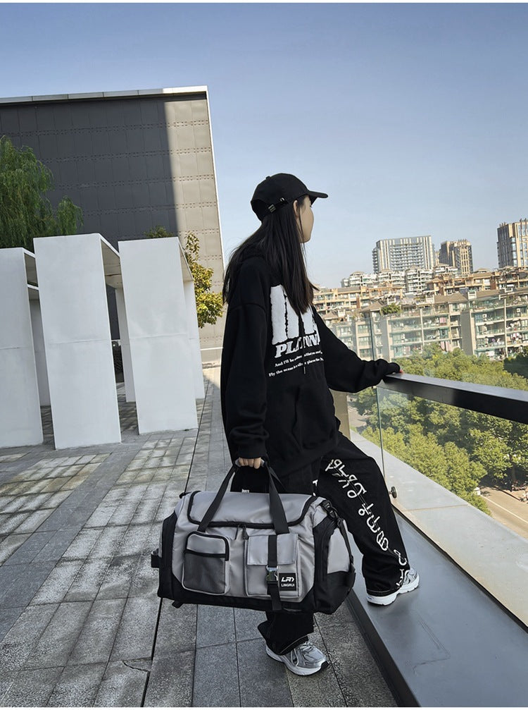 Grey Unisex Travel Bag with Utility Buckles and Wet/Dry Compartments