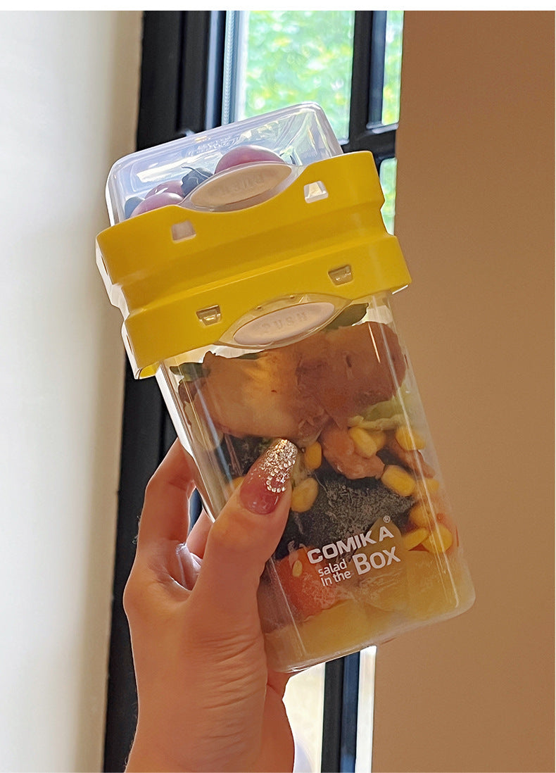 Yellow Portable salad cup with ingredient compartment and fork and spoon - enjoy breakfast on the go