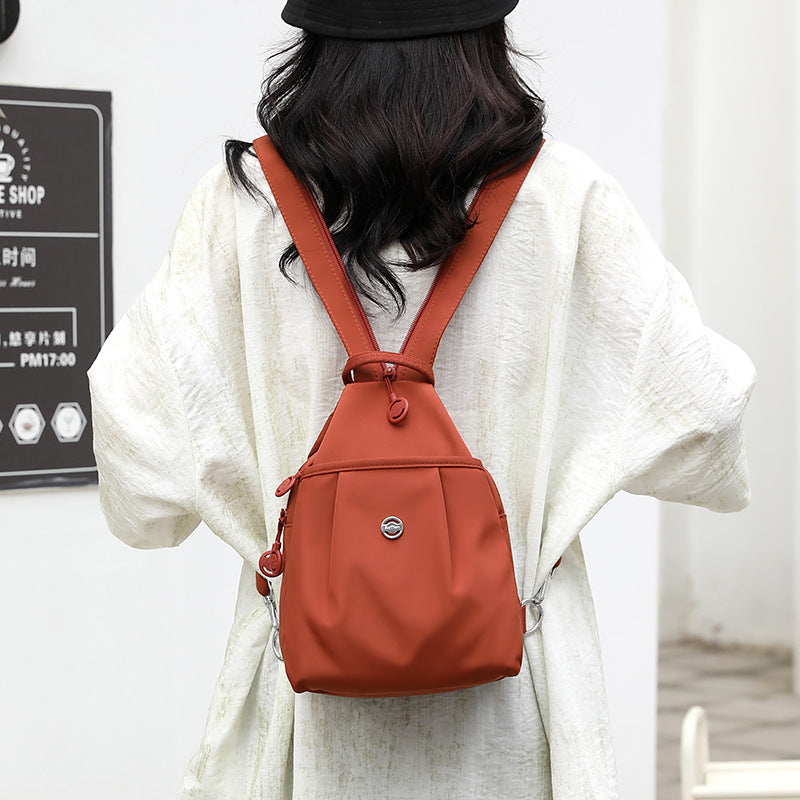 Orange Versatile Women's Convertible Mini Backpack & Sling Bag - Stylish Anti-Theft Oxford Cloth Daypack, Fits 9.7in iPad
