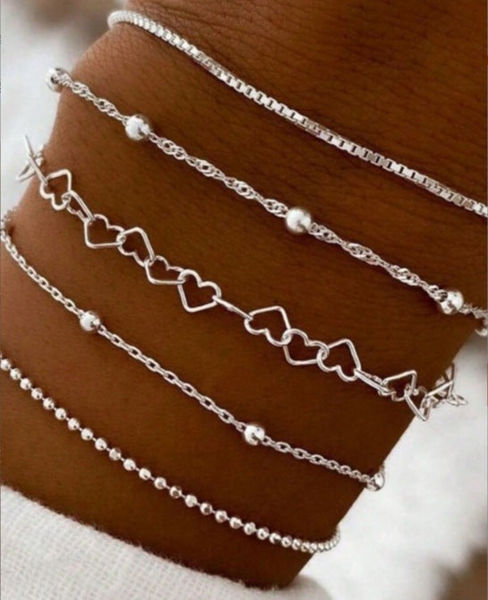 A golden six-piece set Chic Multi-Layered Alloy Bracelet Set - Fashionable Stackable Jewelry