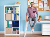 “Office desk set at ergonomic height with a person seated upright, elbows at 90 degrees, and feet flat on the floor.”