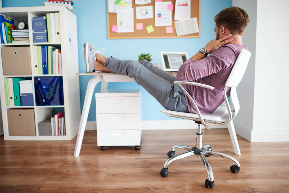 "Modern ergonomic workstation setup showing an adjustable desk at ideal height with a supportive chair, promoting healthy posture during work."