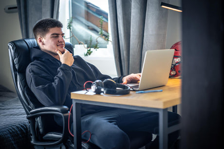 "Modern gaming chair enhancing a work-from-home setup with ergonomic design, adjustable features, and all-day comfort."