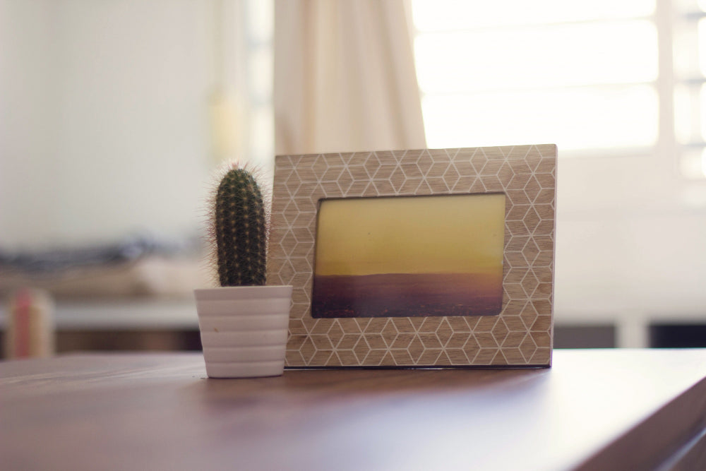 “Side-by-side view showing a cluttered, outdated bedside table transformed into a stylish, organized setup with modern decor.”