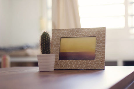 “Side-by-side view showing a cluttered, outdated bedside table transformed into a stylish, organized setup with modern decor.”