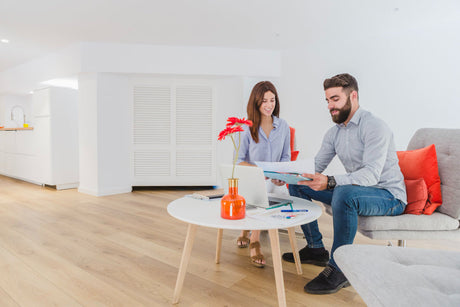 "Living room setup with side table aligned to sofa arm height, demonstrating ideal proportions for accessibility and visual balance."