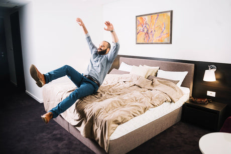 "Couple resting peacefully on a king size mattress, with one partner moving without disturbing the other—illustrating motion isolation benefits."