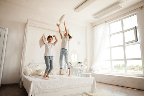 "Modern double mattress with features like zoned support, cooling layers, and space-saving design, styled in a compact yet cozy bedroom."