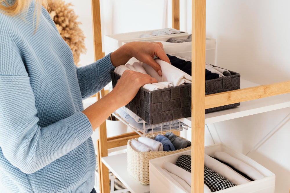 “Neatly organized bathroom cabinet with labeled bins, stacked towels, and daily essentials arranged by category for easy access.”