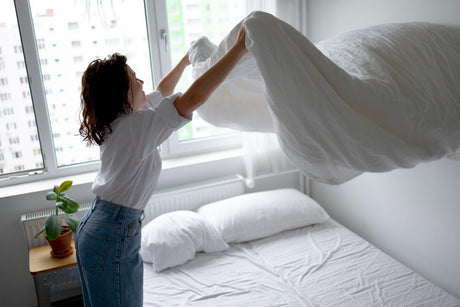  "Cozy king size bed styled with plush pillows, soft linens, and ambient lighting, creating a relaxing and luxurious sleep environment."