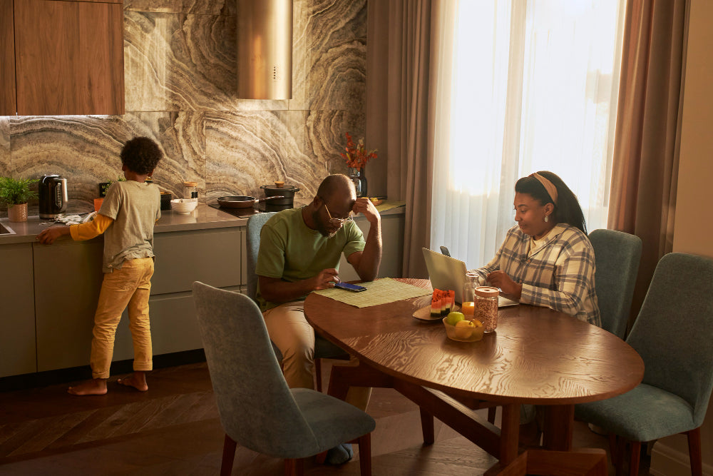 “Modern dining space featuring a 2025-trending dining table with sculptural base, natural wood finish, and designer chairs.”