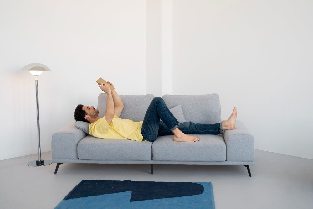 "Elegant living room with a statement sofa enhancing the space through color, shape, and texture for a cohesive and elevated design."