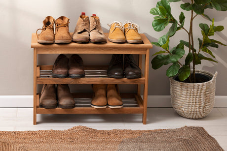 "Stylish entryway setups with designer shoe storage solutions, including built-in benches, mirrored cabinets, floating shelves, and statement units."