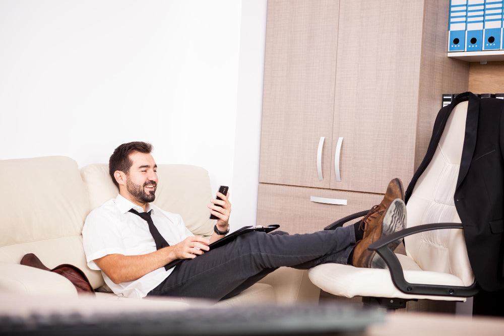 “Electric recliner chair with remote control showing adjustable footrest and backrest features in a cozy living room setting.”