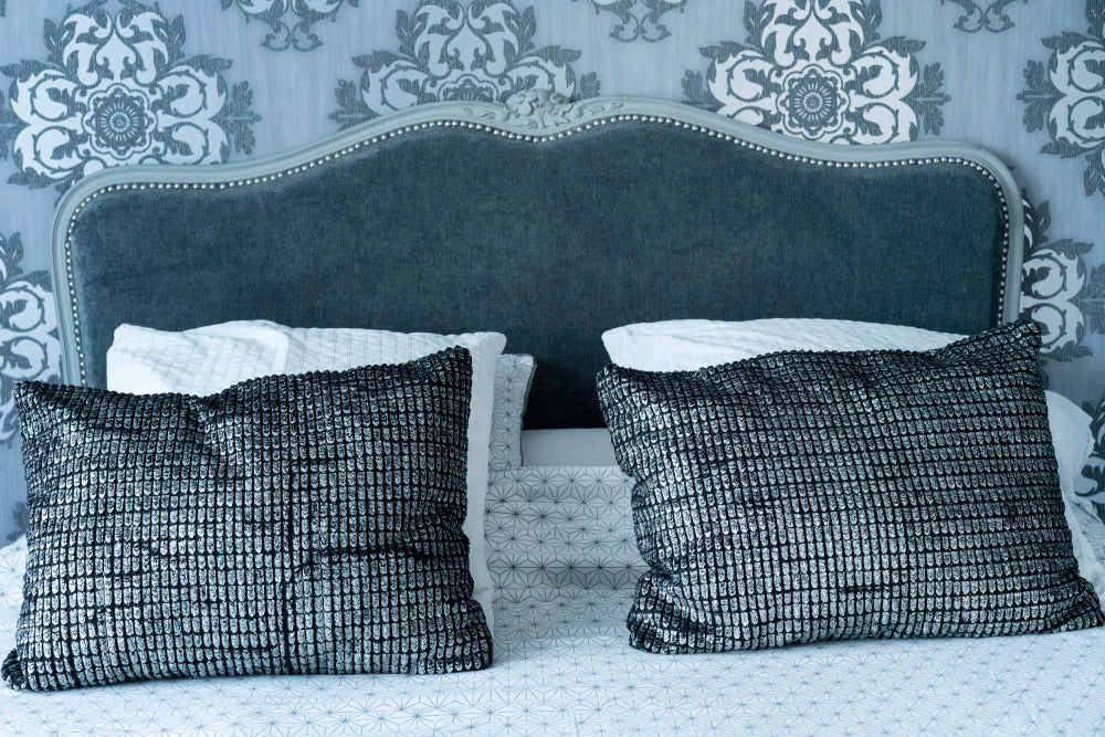 “Collection of headboards ranging from classic wooden designs to modern upholstered and minimalist styles, illustrating the transformation from functional support to decorative statement piece.”