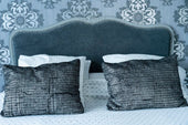 “Collection of headboards ranging from classic wooden designs to modern upholstered and minimalist styles, illustrating the transformation from functional support to decorative statement piece.”