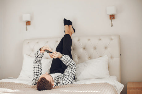 "Double mattress styled with layered bedding, oversized pillows, and a neutral color palette to create the illusion of a larger bed."