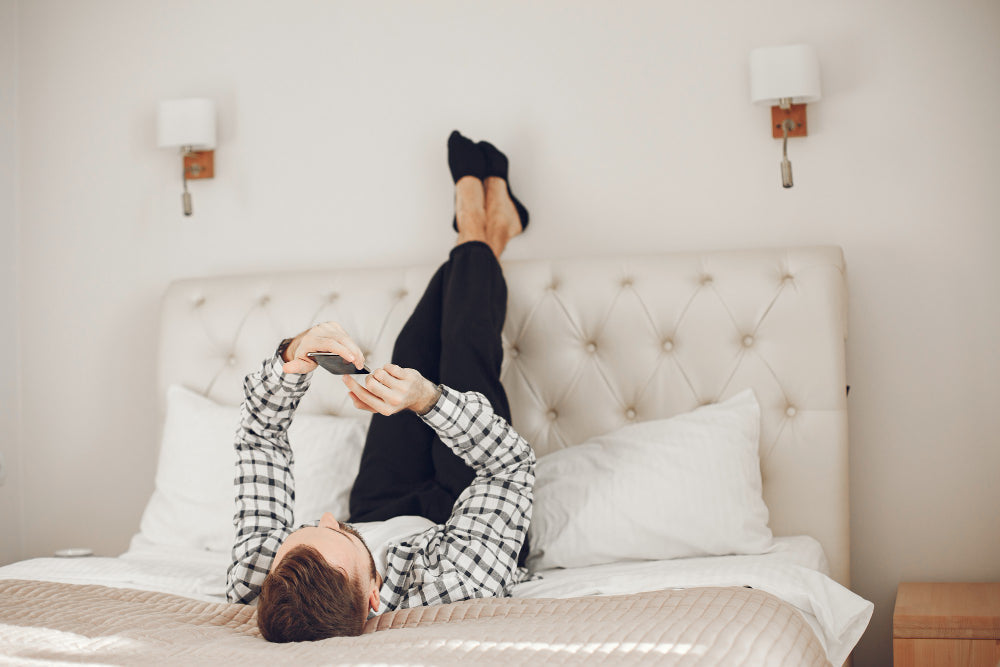 "Double mattress styled with layered bedding, oversized pillows, and a neutral color palette to create the illusion of a larger bed."