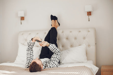 "Double mattress styled with layered bedding, oversized pillows, and a neutral color palette to create the illusion of a larger bed."