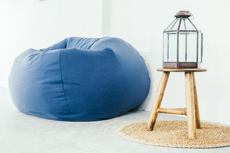 "Stylish home interiors showcasing five creative uses of ottomans and footstools as coffee tables, storage, accent seating, and decorative focal points."