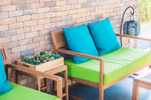 Stylish outdoor sofas with weather-resistant cushions and a durable frame set on a patio