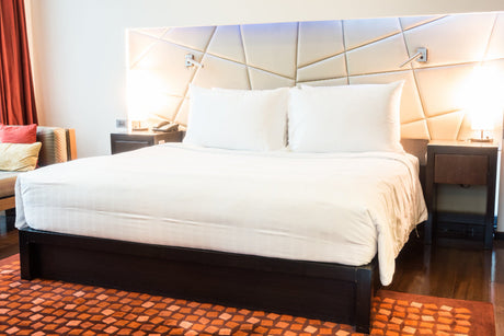 “King single mattress on a minimalist bed frame, measuring approximately 107 cm wide by 204 cm long—perfect for teens and solo adult sleepers needing extra legroom.”