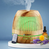 “Cool mist humidifier operating in a bedroom to maintain ideal indoor humidity, potentially easing asthma symptoms.”