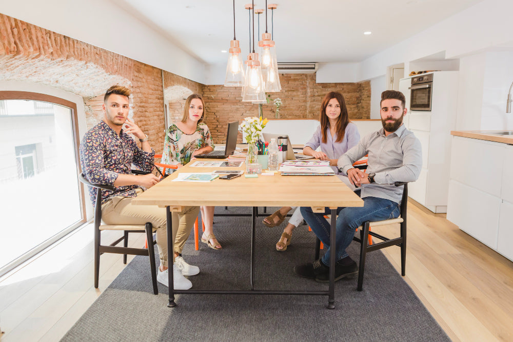 "Dining table setup with measured spacing between chairs and table edges, illustrating ideal dimensions for comfortable seating and movement."