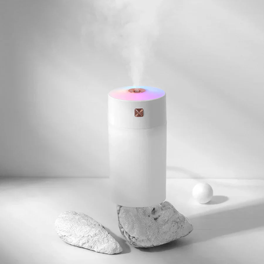 “Modern air humidifier releasing cool mist into a room to increase humidity and improve indoor air quality.”