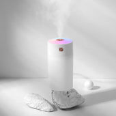 “Modern air humidifier releasing cool mist into a room to increase humidity and improve indoor air quality.”