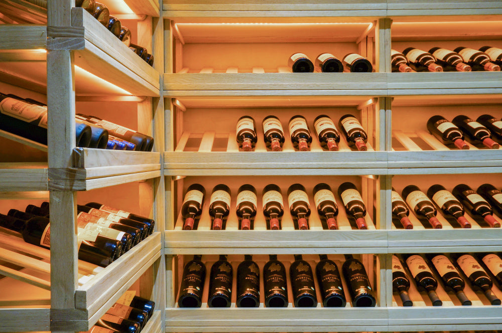 "Wine bottles stored horizontally in a temperature- and humidity-controlled wine rack, demonstrating ideal conditions for preserving flavor and quality."