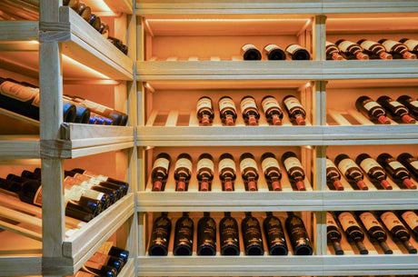 "Wine bottles stored horizontally in a temperature- and humidity-controlled wine rack, demonstrating ideal conditions for preserving flavor and quality."