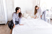 "Spacious king size mattress in a styled bedroom, emphasizing its large dimensions and comfort for couples or families."