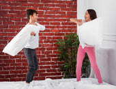 "Side-by-side comparison of a standard King and California King mattress in a bedroom setting, showing differences in width and length for optimal fit."