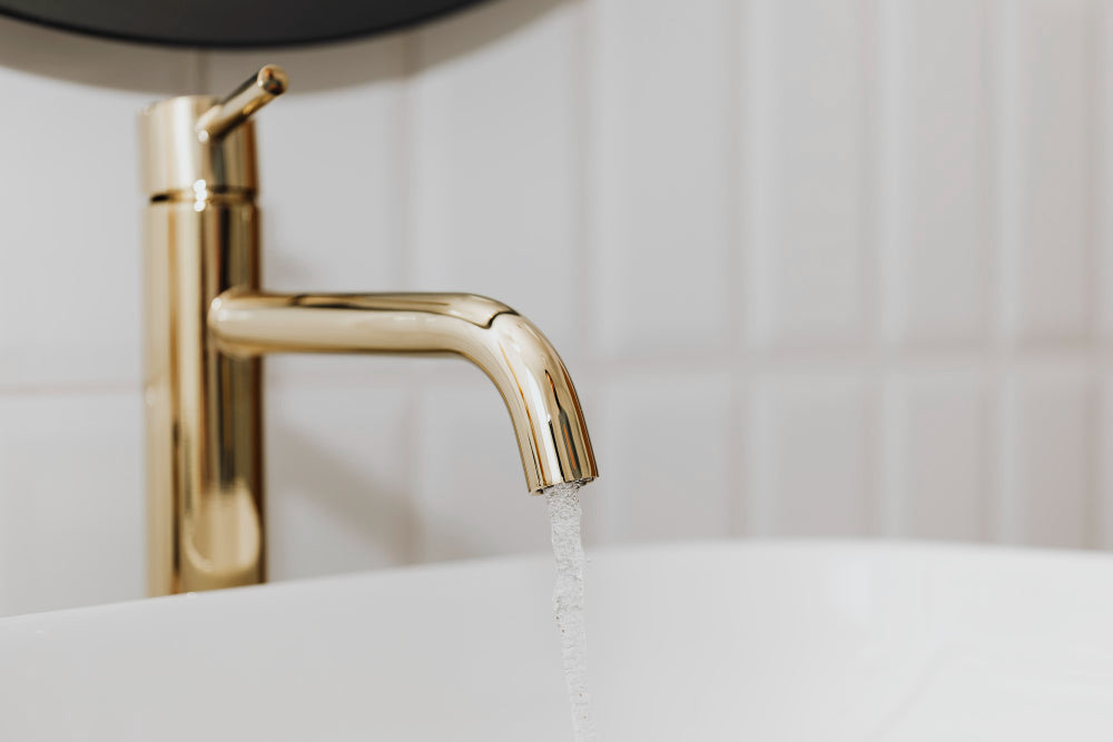 "Side-by-side brass and stainless steel taps, highlighting differences in durability, finish, and style."