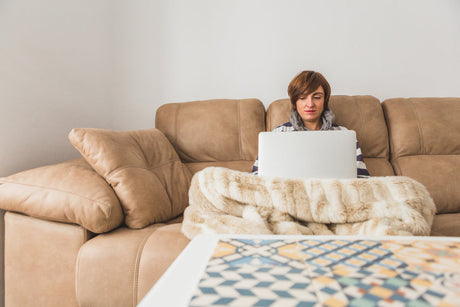  "Premium recliner paired with a matching ottoman in a cozy fall-themed living room, highlighting a seasonal promotion."