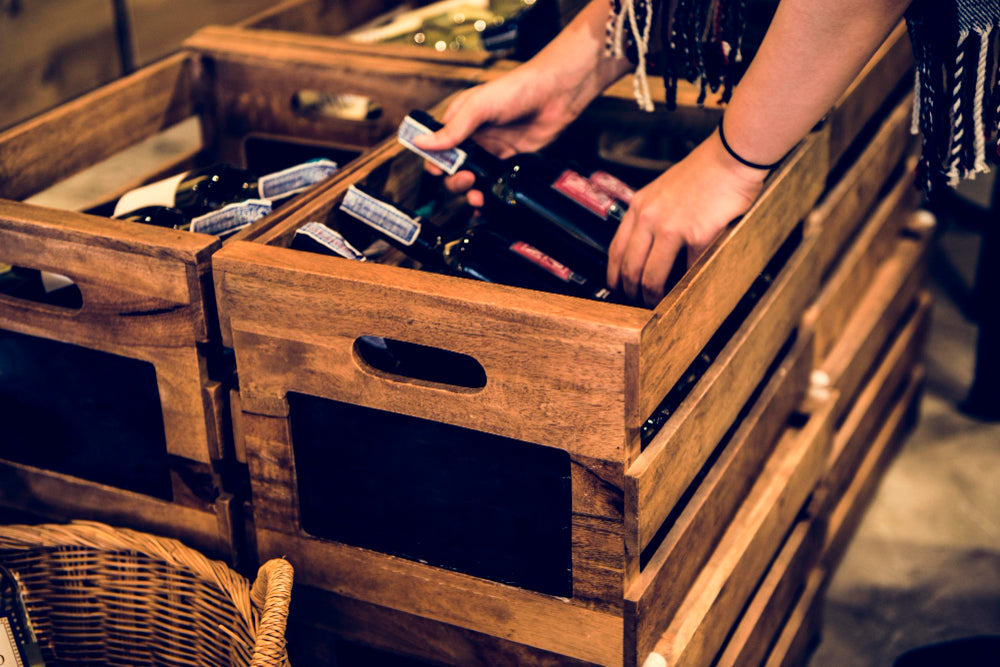  "Wine bottles neatly organized in racks and cabinets, demonstrating optimal storage for preservation and easy access."