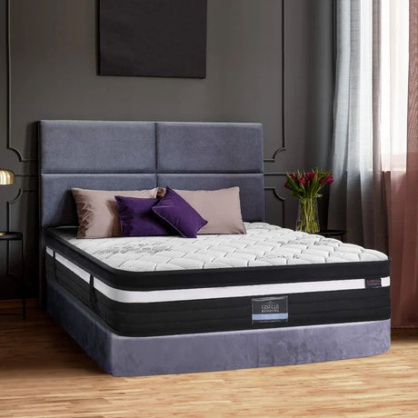  "Inviting guest room featuring a neatly dressed double mattress, soft lighting, and thoughtful amenities for a welcoming overnight stay."