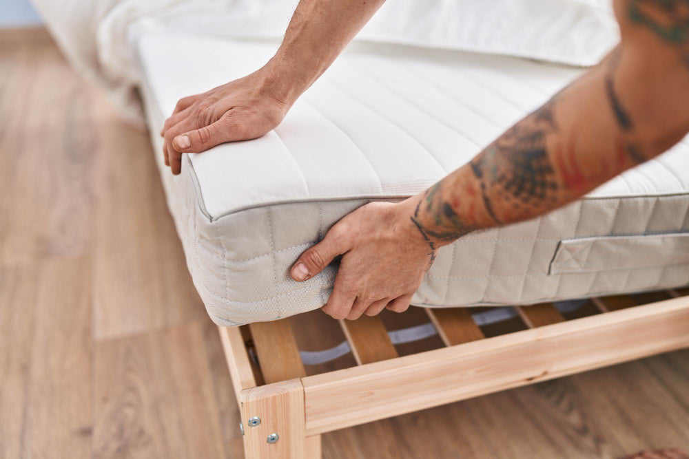 "King size mattress placed in a well-organized bedroom, showing smart layout and space-saving furniture for optimal fit."