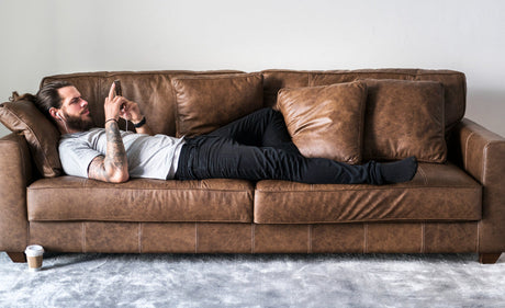 "Side-by-side leather and performance fabric recliners, comparing durability, stain resistance, and family-friendly features."