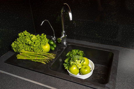 "Side-by-side stainless steel and composite granite sinks, comparing durability, aesthetics, and maintenance needs."