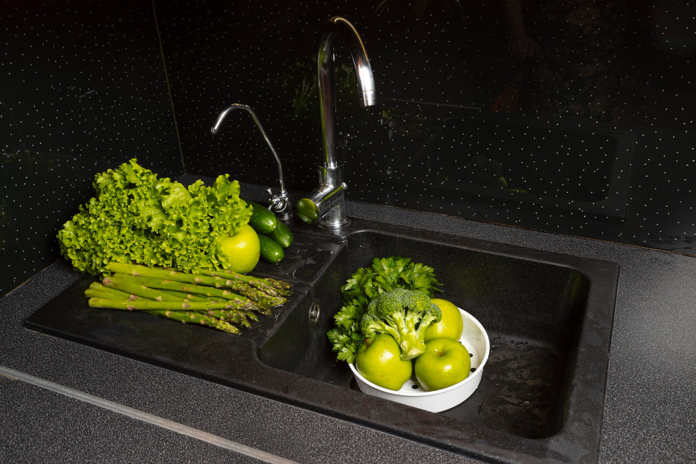"Side-by-side stainless steel and composite granite sinks, comparing durability, aesthetics, and maintenance needs."