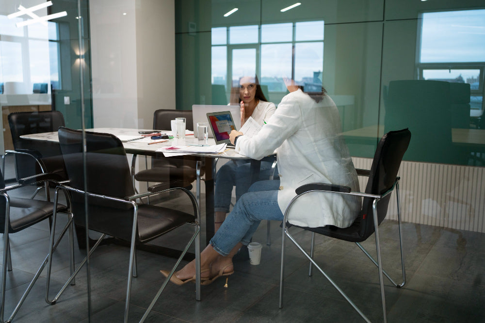 "Ergonomic office chair with lumbar support at a workstation, emphasizing posture and long-term comfort for spinal health."