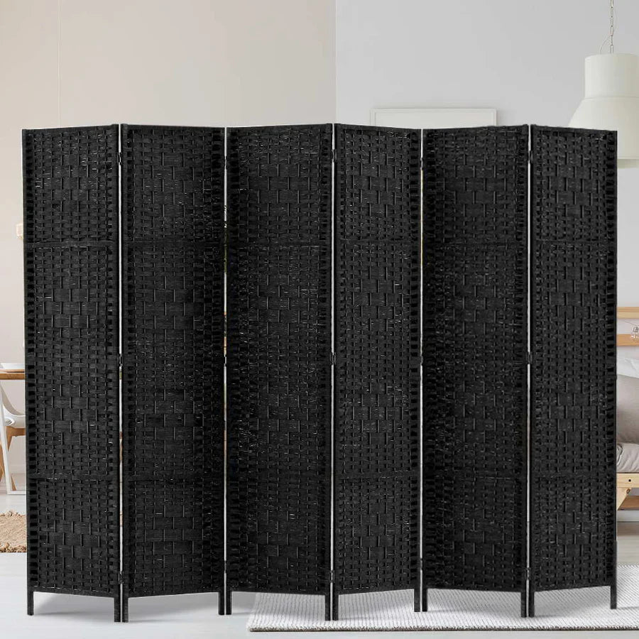 "Modern living space with a stylish room divider separating the lounge and dining areas—showcasing how dividers influence spatial perception, privacy, and ambiance."