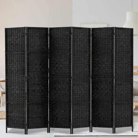 "Modern living space with a stylish room divider separating the lounge and dining areas—showcasing how dividers influence spatial perception, privacy, and ambiance."